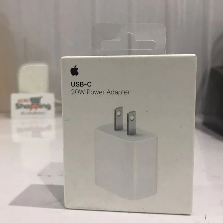 Apple USB-C power adapter packaging on a white surface