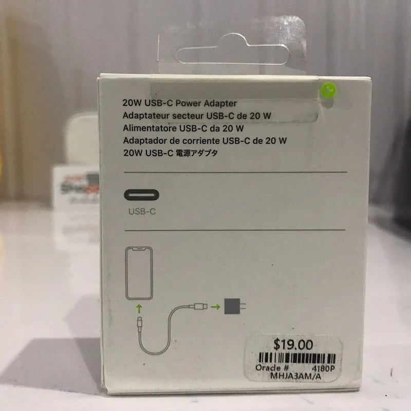 20W USB-C power adapter packaging on a table with a blurred background